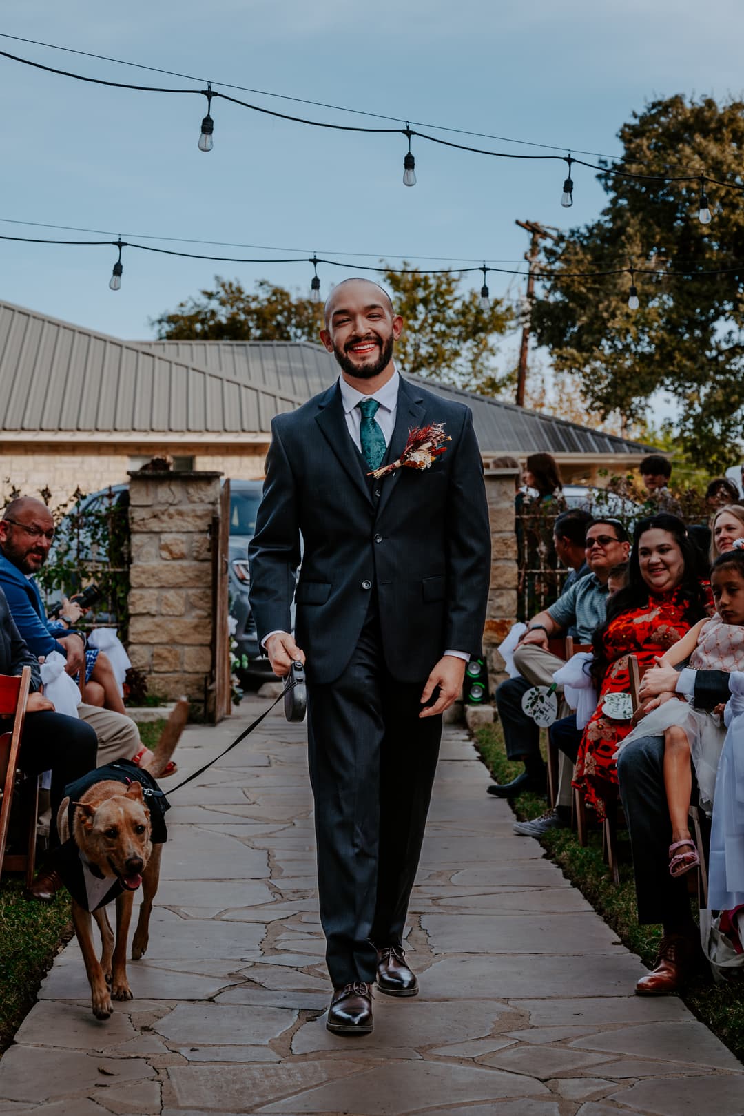 Groom walking down the aisle with Best Dog