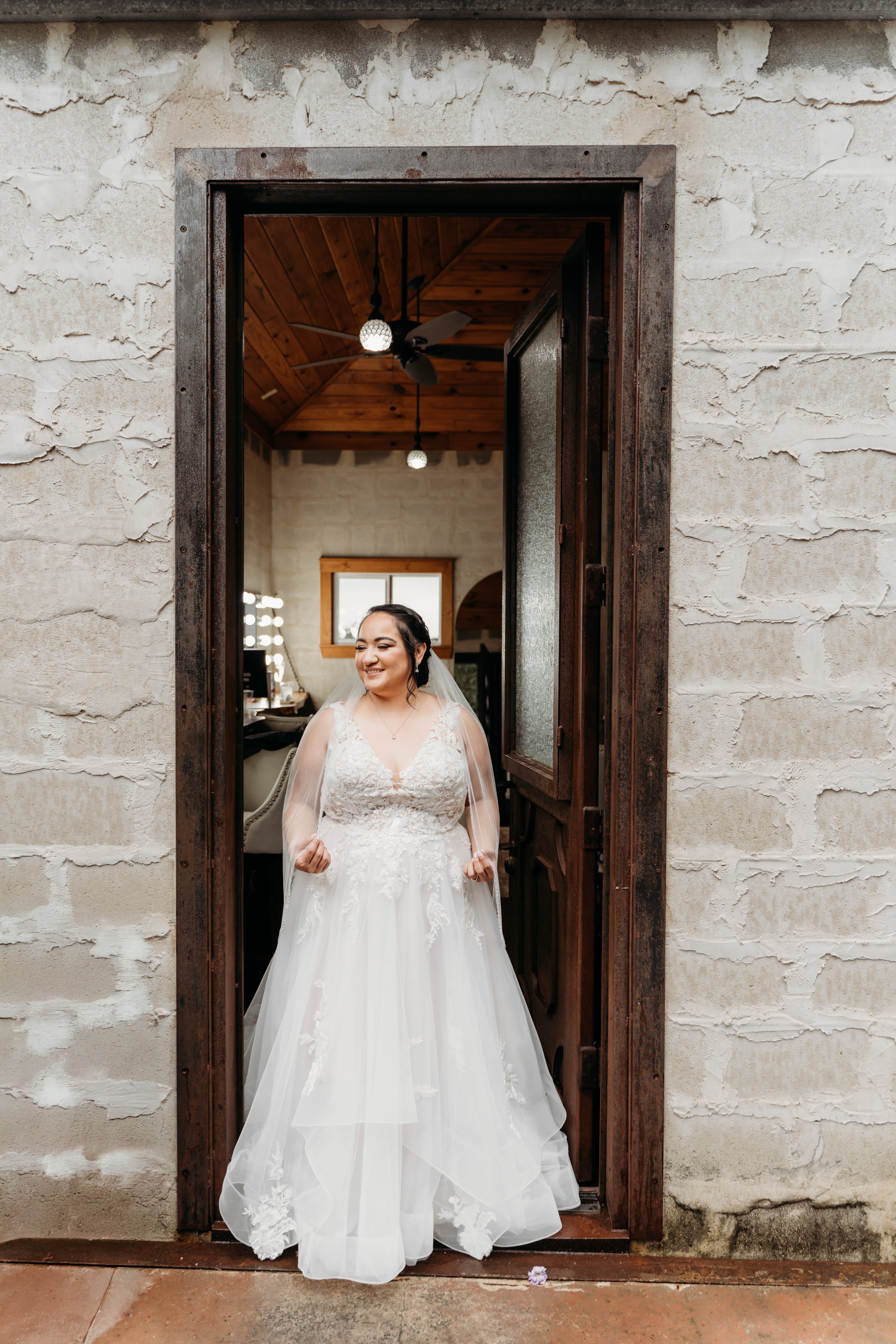 Our Blushing Bride Samantha Samantha is posing in the bridal suite of The Oaks at Heavenly!