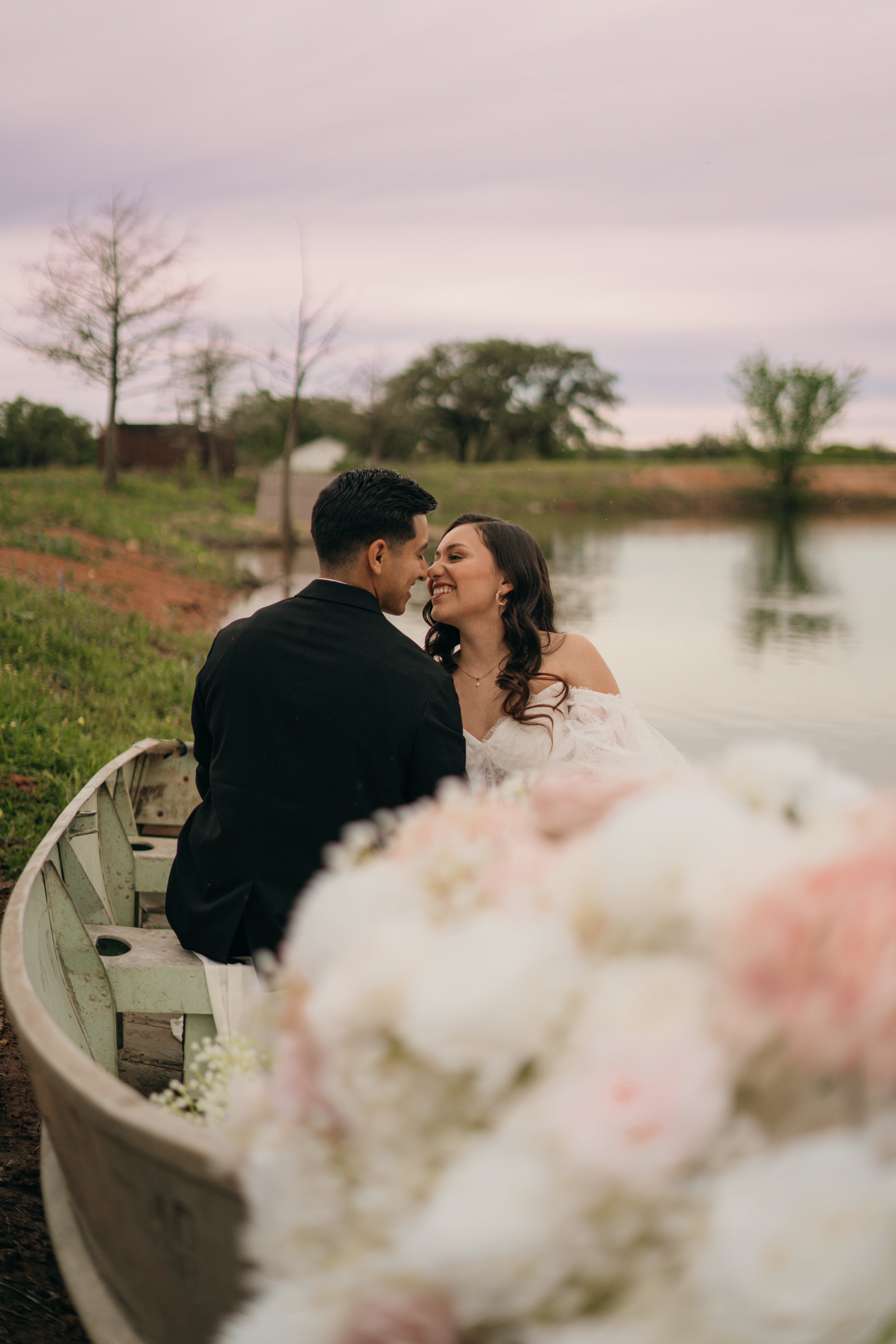 Bride & Groom posing in boat Bride & Groom posing in boat