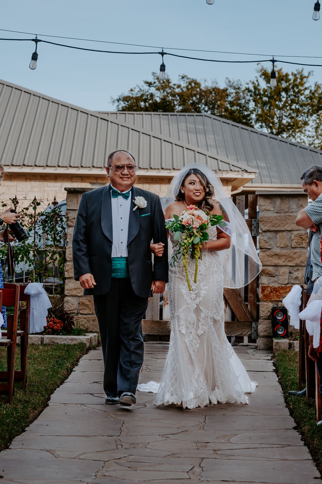 Bride walking down the aisle with Grandfather